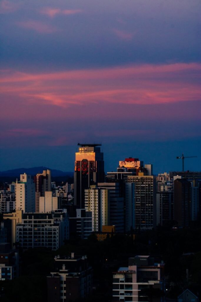 Urban skyline illuminated by stunning twilight colors, showcasing modern architecture.
