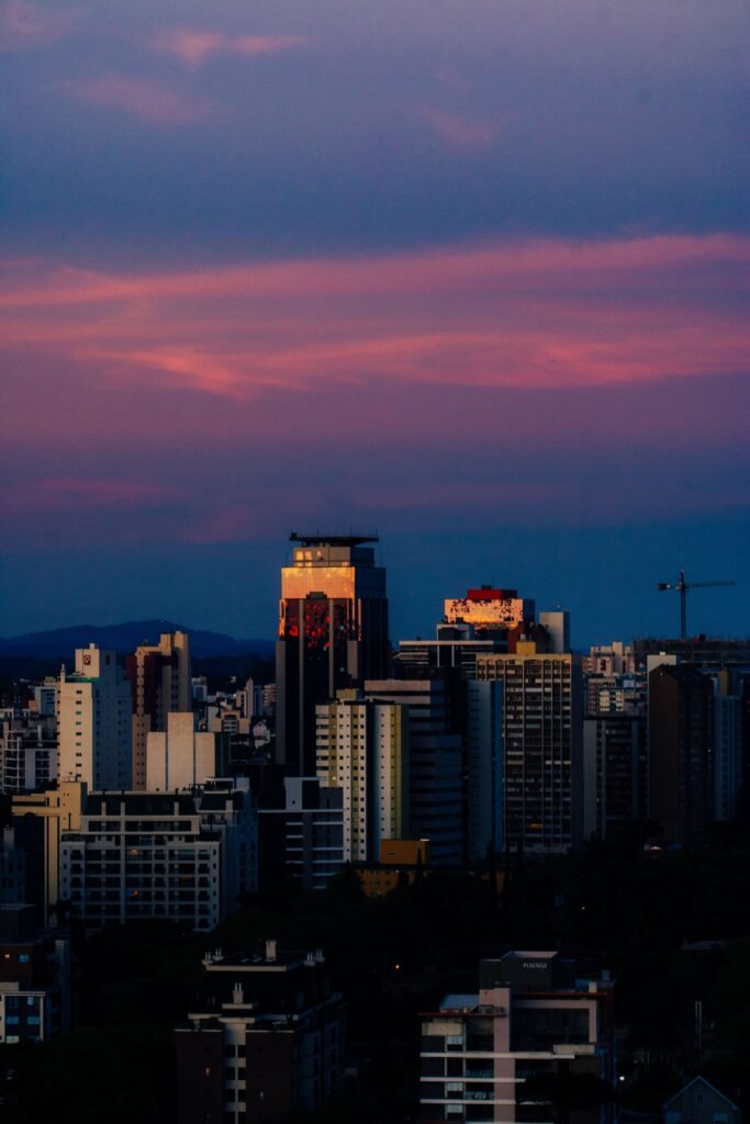 Urban skyline illuminated by stunning twilight colors, showcasing modern architecture.
